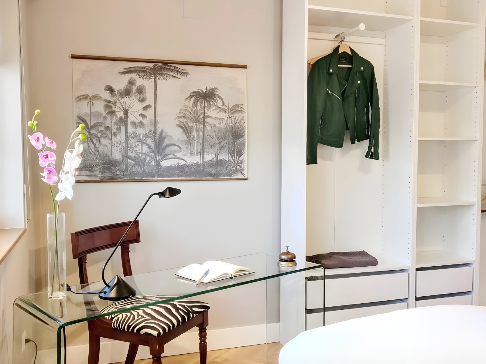 Bright workspace and bedroom area in a fully furnished apartment in Barcelona